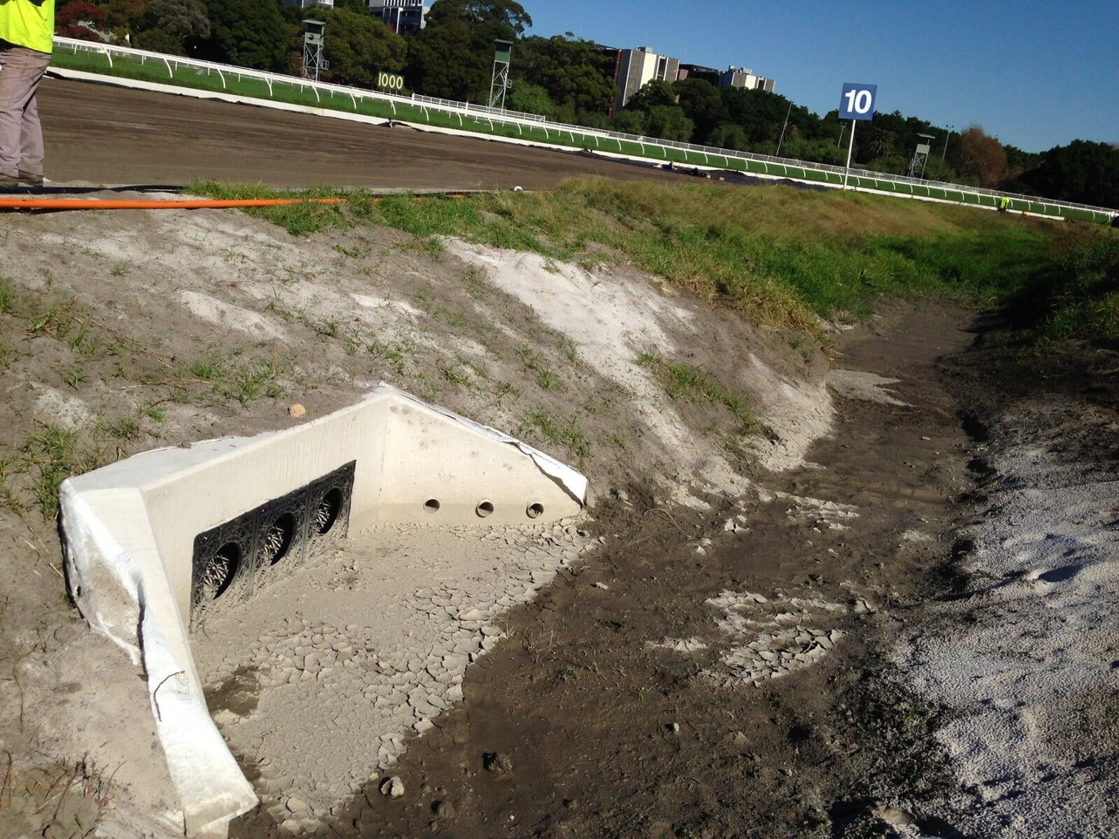 Flo-Channel drainage channel applied in a large-scale infrastructure project for water flow regulation.